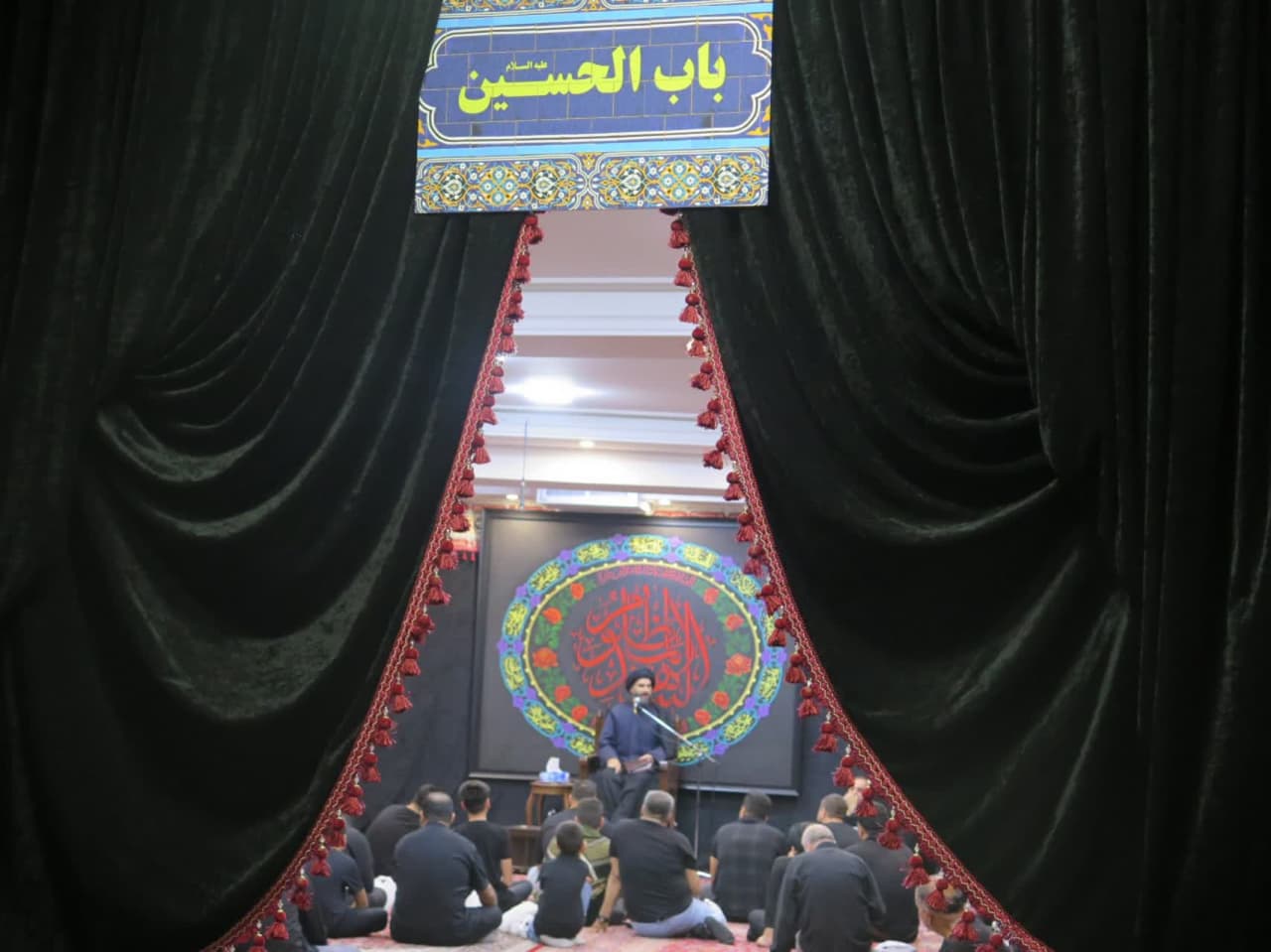 Mourners participating in the mourning ceremony for Imam Hussain, peace be upon him, who was martyred in Karbala