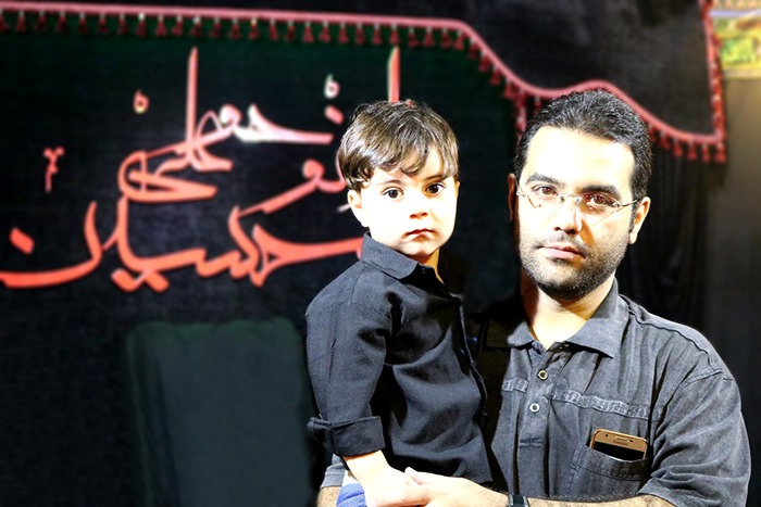 father and Baby in the House of mourning for Hussein in Celebration of Ashura 2017