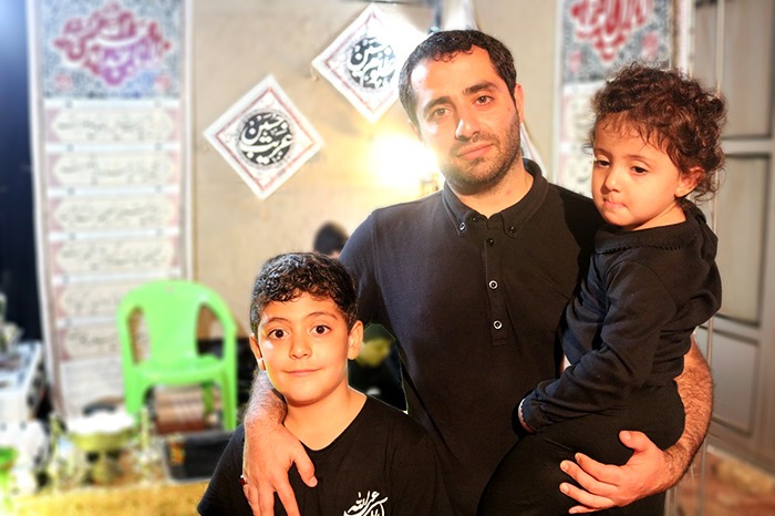 Shia Muslim father and Babies mourned on the day of Ashura and perform their rituals in the houses of Iran