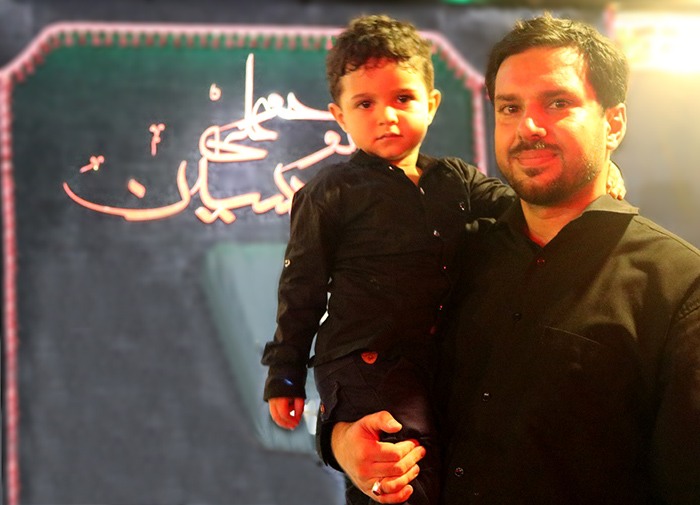 a father and his child lbaik ya hussain in Ashura 2017