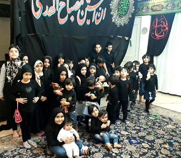 Baby in the House of mourning for Hussein in Celebration of Ashura